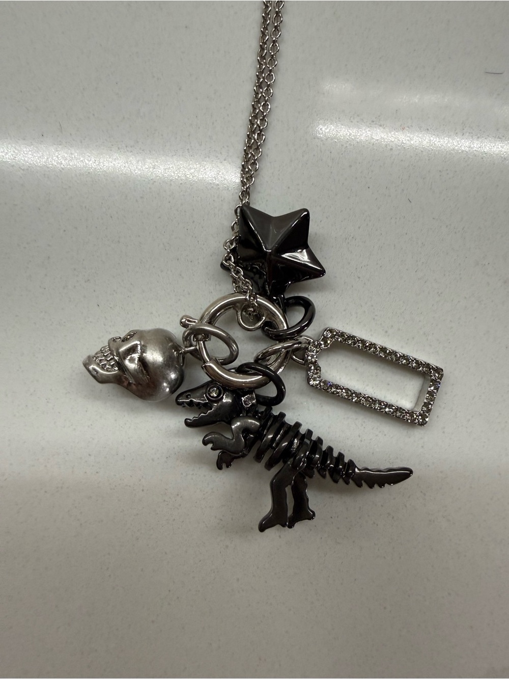 Coach Silver & Black Dinosaur Skeleton Charm Necklace with Crystal Frame